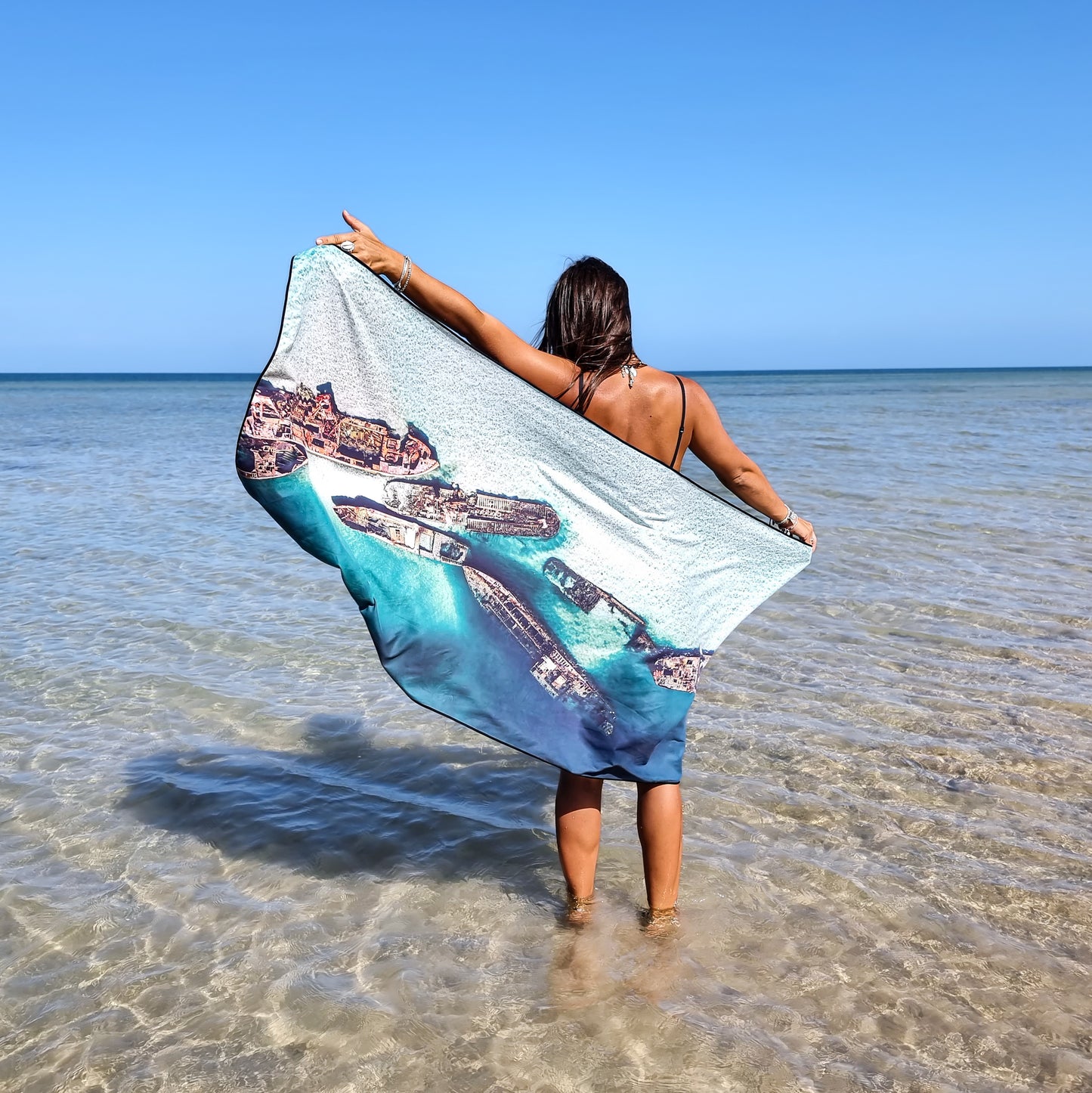 Tangalooma Wrecks Travel TowelSand Free Microfiber Travel Towel For the beach, travelling, camping, exercising and more! Sustainably made using post-consumer plastic in the form of recycled Polyester (rPET)Inspired by the iconic cluster of sunken ship wrecks off Moreton Island, QLD15 ships were sunk by the Queensland Government between 1963 and 1984 to provide safe anchorage for recreational boat owners on the Eastern side of Moreton Bay.Now home to a large variety of reef fish, coral and marine life, makin