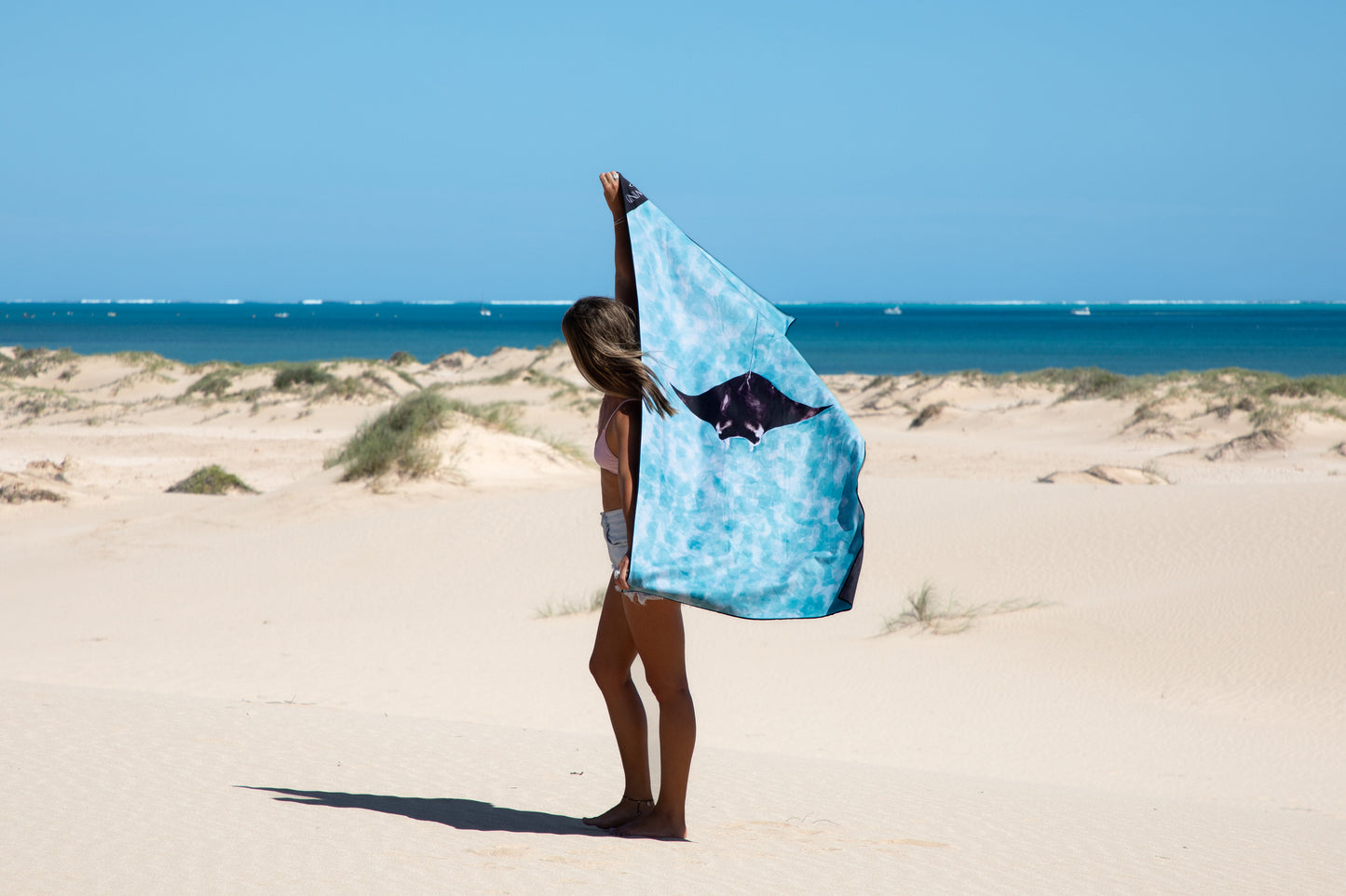 Manta Ray Travel TowelInspired by the crystal clear blue water on the Ningaloo Reef.We often pop our sunglasses down just to check it's not a filter, only to confirm it is in fact PARADISE. Watch as the Manta Rays gracefully glide through what can only be described as 'glassy seas'Sand Free, Quick Dry Travel Towel For the beach, travelling, camping, exercising and more! Sustainably made using post-consumer plastic in the form of recycled Polyester (rPET)in our signature buttery soft Microfiber Suede$64.99Wi